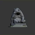 Sitting Bear Sculpture Decorative Artwork with Detailed Green Mossy Base and Realistic Design