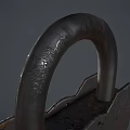 Vintage Metal Door Handle Featuring Ornate Carvings And Decorative Rivet Accents