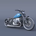 Classic Blue Vintage Motorcycle With Black Accents Wide Tires And Silver Exhaust