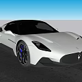 Silver Maserati Sports Car With Sleek Exterior Black Wheels And Logo By Waterfront