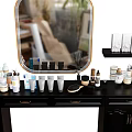 Black Dressing Table With Round Gold Frame Mirror And Organized Cosmetics Skincare Products