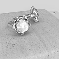 Elegant Silver Jewelry Ornament Set With Clear Gemstones On Gray Stone Surface
