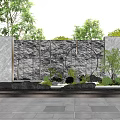 Modern Water Feature Wall With Flowing Water Green Plants And Stone Pavement
