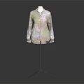 Stylish Long Sleeved Coat With Light Green And Beige Floral Pattern On Mannequin Stand