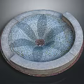 Circular Decorative Fountain Basin With Intricate Mosaic Flower Pattern And Stone Border