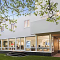 Modern Detached House With White Exterior Geometric Design Circular Window Front Steps And Lawn