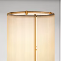 Modern Floor Lamp With Gold Metal Frame And Textured Fabric Shade
