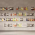 Wine Bottles and Glasses Collection Arranged Neatly on Wall