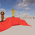 Decorative Ornament Set With Gold Silver Trophies On Red Draped Platform Against Blue Sky