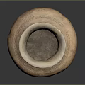 Ancient Hand Carved Clay Pot With Intricate Surface Patterns And Textures