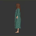 Woman In Green Long Dress With White Trim Standing Barefoot Against Gray Background