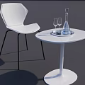 Modern White Round Table and Chair with Black Legs Transparent Water Bottle and Wine Glasses