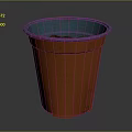Vibrant Orange Garden Flower Pot With Blue Rim And Fresh Soil Inside