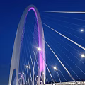 Modern White Arch Bridge With Cable Stay Design Over River And Blue Sky