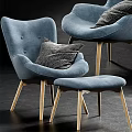 Blue Leisure Chairs With Gray Decorative Pillows And Light Wooden Legs And Ottoman