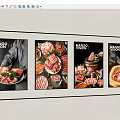 Yellow Decorative Light Strips Surrounding Four Black Framed Meat Posters On Gray Wall