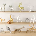 Silhouette Deer Figurines Arranged On Wooden Shelves With Gold Silver White Styles