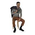 Smiling Man Sitting On Wooden Chair With Gray Sweater Brown Pants And Scarf