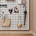 Pegboard Wall with Hats Headphones Clock Photo Frames and Decorative Ornaments Set