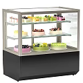 Retail Bakery Display Case With Assorted Cakes And Desserts On Glass Shelves