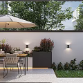 Stylish Outdoor Garden Decor in Walled Space with Umbrella Dining Set Wall Lights and Greenery