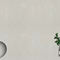 Beige Background Wall Interior with White Spherical Decor Clear Vase and Green Plant Sprigs