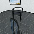 Black Accent Chair With Curved Arms And Slim Metal Legs In Modern Space