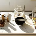 Elegant Decorative Ornament Set with Wooden Pieces Glass Containers and Black Bowl on Marble Countertop
