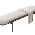 Light Beige Fabric Upholstered Bench with Black Metal Legs and Draped Knit Blanket