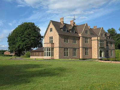 Detached Villa Featuring Red Brick Exterior Green Lawn And Tall Trees Under Blue Sky 3d model