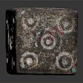 Decorative Dice With Circular Patterns And Textured Red Green Copper Surface On Black Background