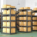 Metal Storage Shelves Loaded With Cardboard Boxes And Female Worker In Warehouse