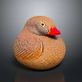 Brown Duck Decorative Sculpture With Red Beak Yellow Eyes And Feathered Texture On Dark Background