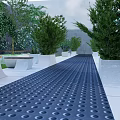 White Concrete Tree Planters With Green Trees And Black Perforated Walkway
