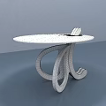 Modern Coffee Table With Round White Tabletop And Unique Black Curved Legs