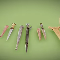 Various Decorative Knives with Diverse Blades and Handles on Green Background