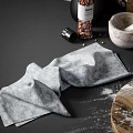 Natural Kitchenware Display On Counter With Wooden Chopping Boards Mortar Pestle And Wicker Baskets