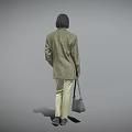 Woman in Plaid Blazer White Shirt Beige Pants Holding Gray Handbag Standing Against Gray Background
