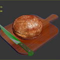 Golden Freshly Baked Artisan Bread On Wooden Cutting Board With Knife