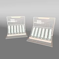 Decorative Cosmetic Display Stand Set with White Lipstick Holders Golden Frame Pink Accents Marble Background