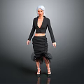 Woman with white hair wearing black deep V top and ruffled skirt in gray background