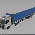 White Semi Trailer Truck With Blue Cargo Container And Reflective Surface