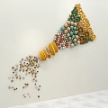 Colorful Cone Shaped Decorative Bead Art With Scattered Beads At Bottom