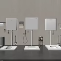 Modern Three White Urinals Against Gray Walls With Trash Cans Toilet Paper Holders Flushing Devices