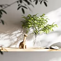 Transparent Vase With Green Foliage On Light Wooden Shelf Wooden Giraffe Open Book Sunlight Shadows