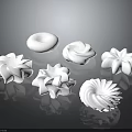 White Whipped Cream Dessert Decorations With Various Flower Spiral And Round Shapes On Black Background