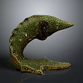 Decorative Green C Shaped Animal Sculpture With Spotted Surface And Holes