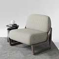 Modern Light Gray Fabric Single Sofa With Wooden Frame Next To Small Round Side Table 3d model