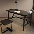 Black Desk With Table Lamp Books And Stool Near Window On Wooden Floor