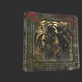 Decorative Vintage Tile With Intricate Golden Pattern And Red Green Accents